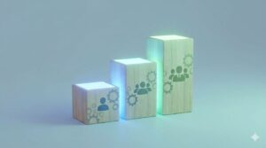 3つの高さが異なる光る木製ブロック。それぞれに抽象的な「初任層」「中堅層」「指導層」の役割を象徴する模様。